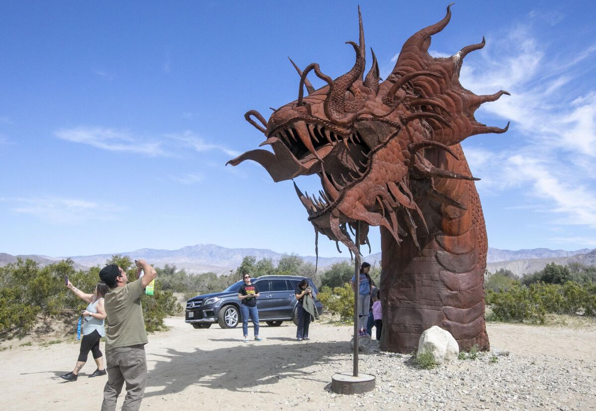 Although Anza-Borrego Desert State Park is closed, the works of artist Ricardo Breceda are on private property and not closed. Two Vista families escaped their homes to get some fresh air in Borrego Springs, CA, on Wednesday, April 1, 2020 during the Coronavirus pandemic.