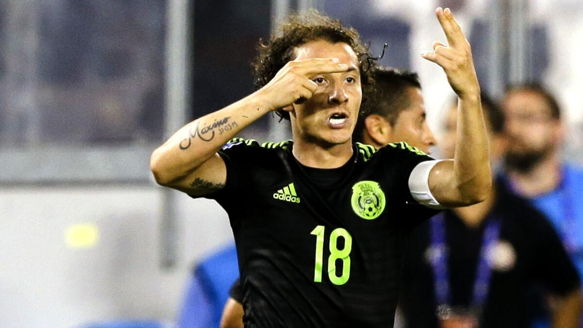 Mexico's Andres Guardado (18) celebrates after scoring the only goal of the game against Costa Rica on a penalty kick in extra time Sunday night.