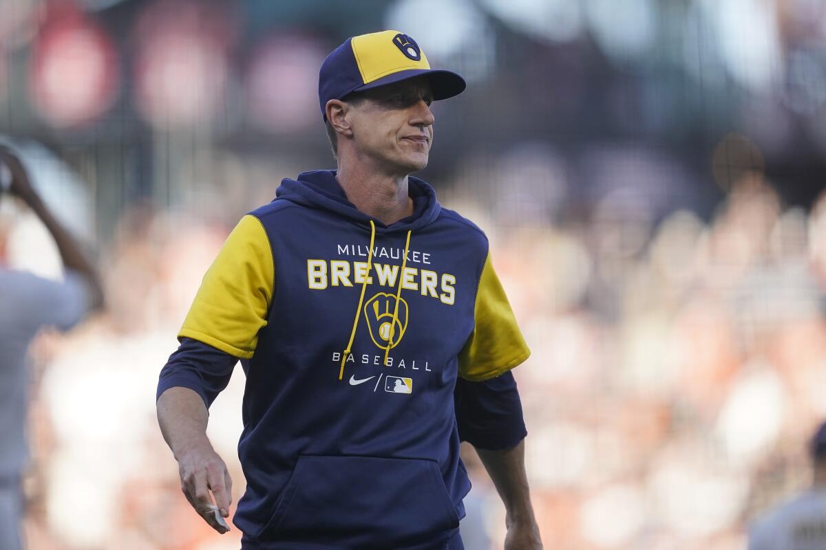 Milwaukee Brewers manager Craig Counsell walks to the dugout after making a pitching change during the eighth inning of the team's baseball game against the San Francisco Giants in San Francisco, Saturday, July 16, 2022. (AP Photo/Jeff Chiu)