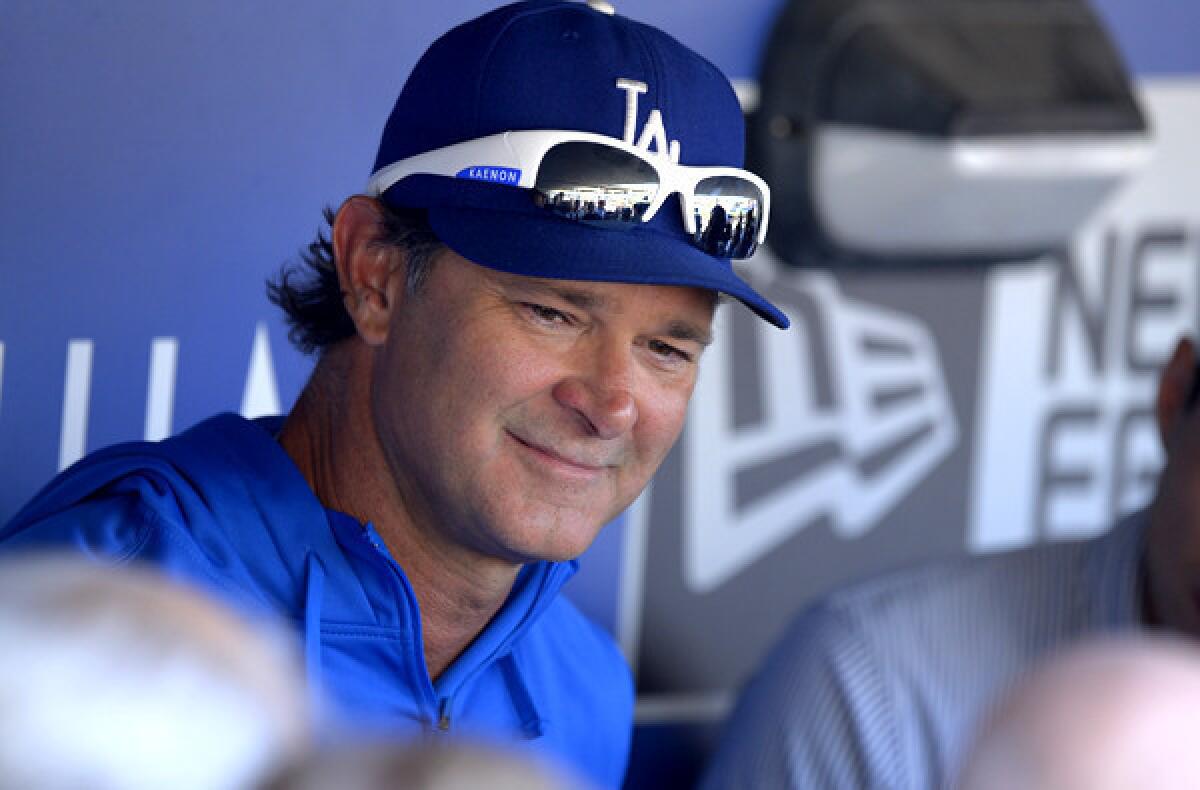Dodgers Manager Don Mattingly talks to reporters before a game earlier this season.