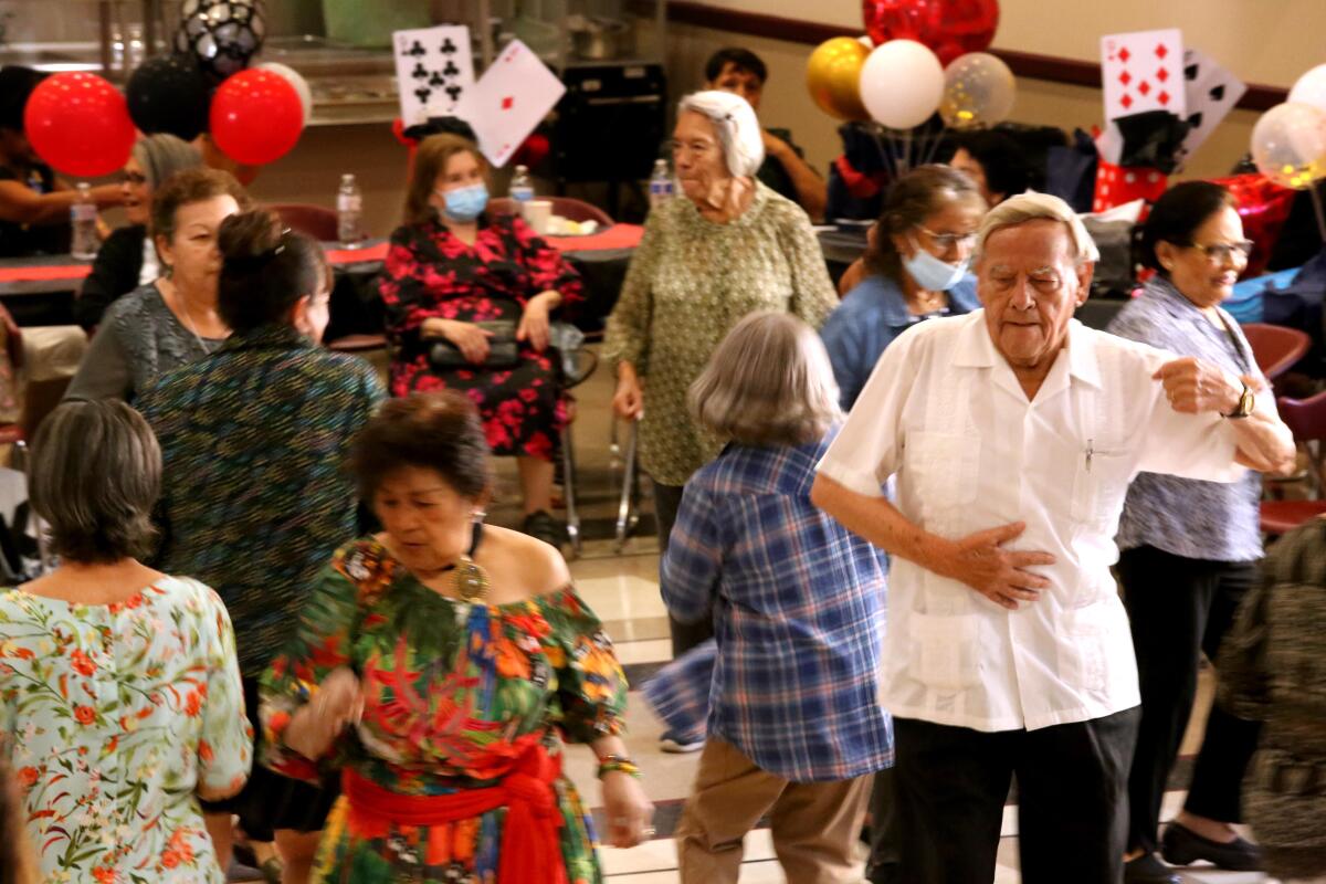 A man dances at the Crescent Arms senior housing in Los Angeles.