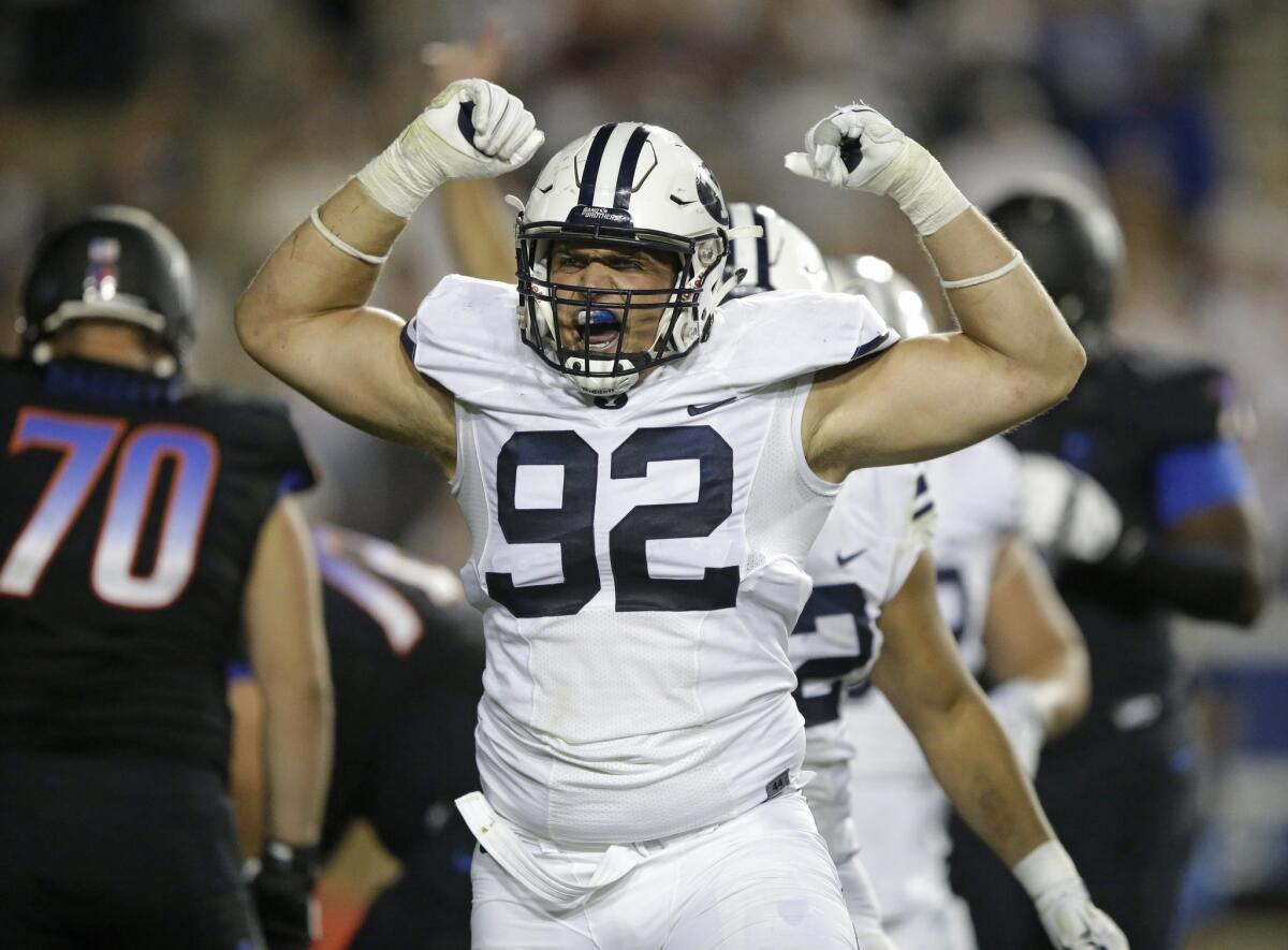 BYU defensive lineman Graham Rowley reacts after a play against Boise State on Saturday.