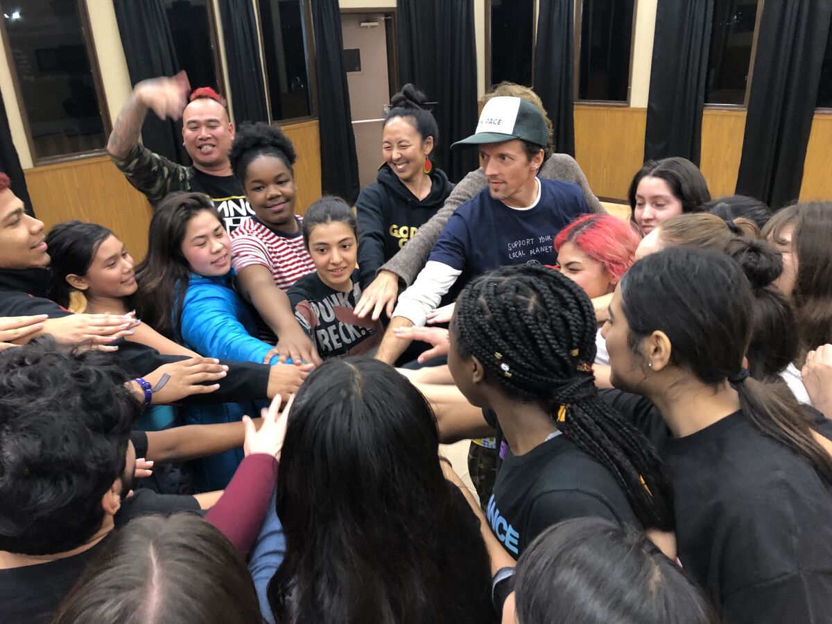 Jason Mraz (center right) with young performers from the San Diego troupe transcenDANCE.