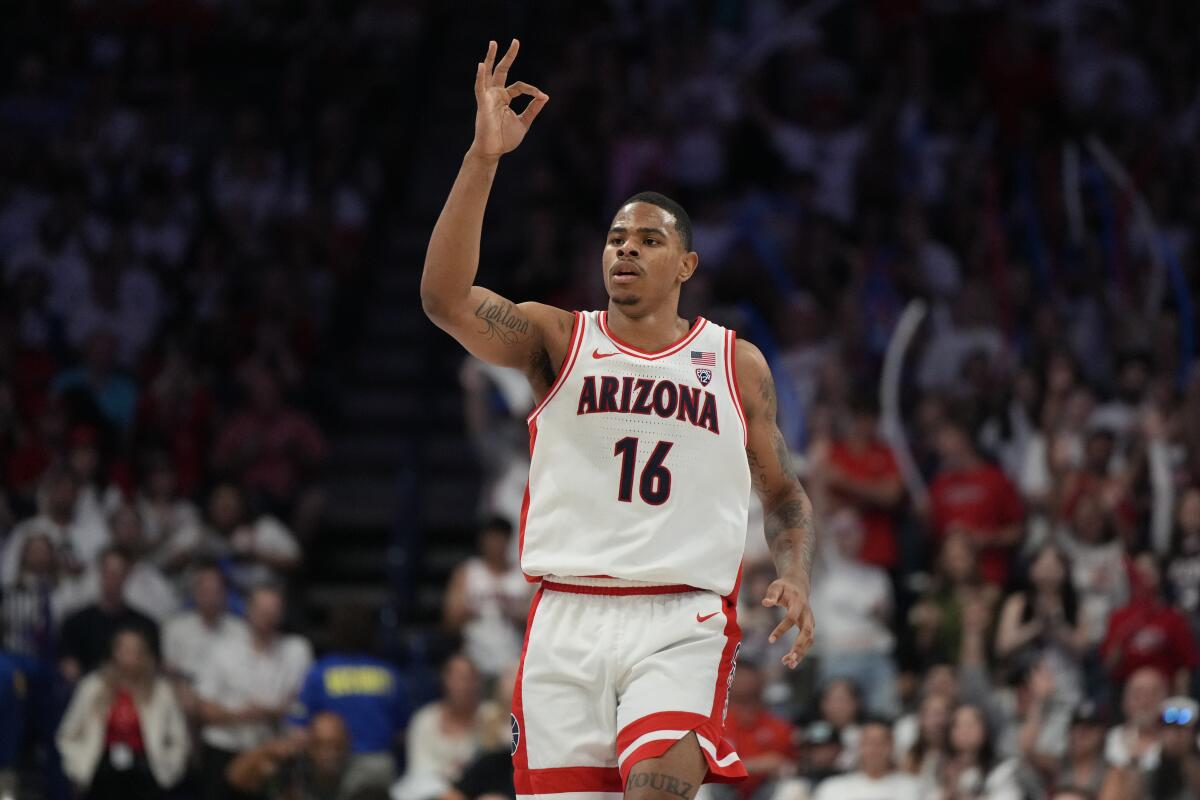 Arizona forward Keshad Johnson reacts after scoring against Oregon during a March 2 game.
