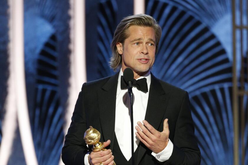 This image released by NBC shows Brad Pitt accepting the award for best supporting actor in a film for his role in "Once Upon A Time...In Hollywood" at the 77th Annual Golden Globe Awards at the Beverly Hilton Hotel in Beverly Hills, Calif., on Sunday, Jan. 5, 2020. (Paul Drinkwater/NBC via AP)