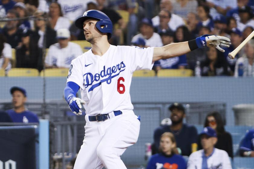 Los Angeles, CA - October 11: Los Angeles Dodgers' Trea Turner tosses his bat.