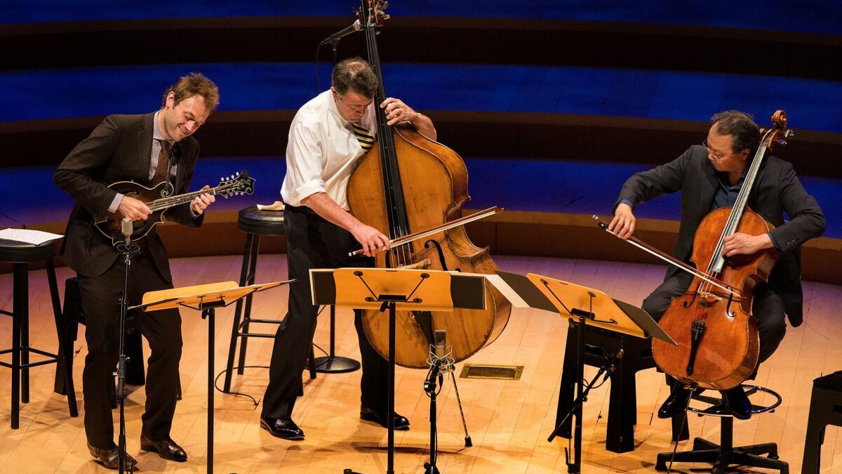 Mandolinist Chris Thile, from left, bassist Edgar Meyer and cellist Yo-Yo Ma perform Bach trios at Walt Disney Concert Hall on Wednesday.