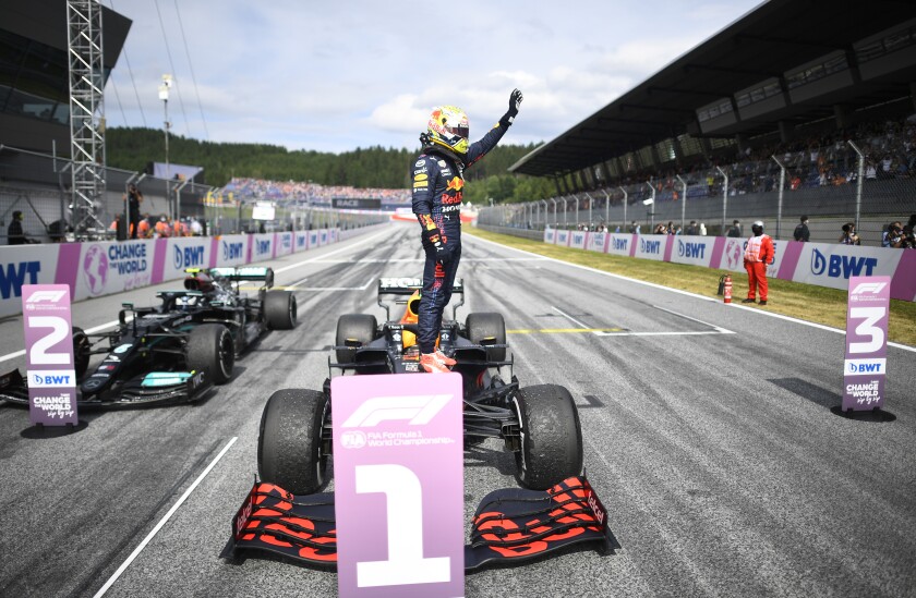 Red Bull driver Max Verstappen of the Netherlands jubilates on top of his car after winning the Austrian Formula One Grand Prix at the Red Bull Ring racetrack in Spielberg, Austria, Sunday, July 4, 2021. (Christian Bruna/Pool Photo via AP)