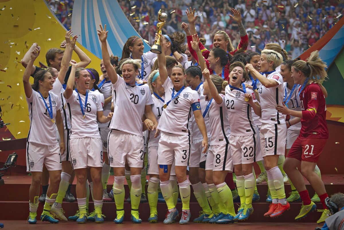 TOPSHOTS Members of the USA celebrate winning the the championship football match against Japan at during the 2015 FIFA Women's World Cup in Vancouver on July 5, 2015. AFP PHOTO/ANDY CLARKANDY CLARK/AFP/Getty Images ** OUTS - ELSENT, FPG - OUTS * NM, PH, VA if sourced by CT, LA or MoD **