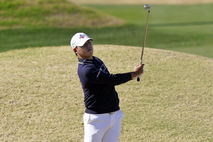 Si Woo Kim hits from the rough off the fifth fairway during the final round of The American Express.