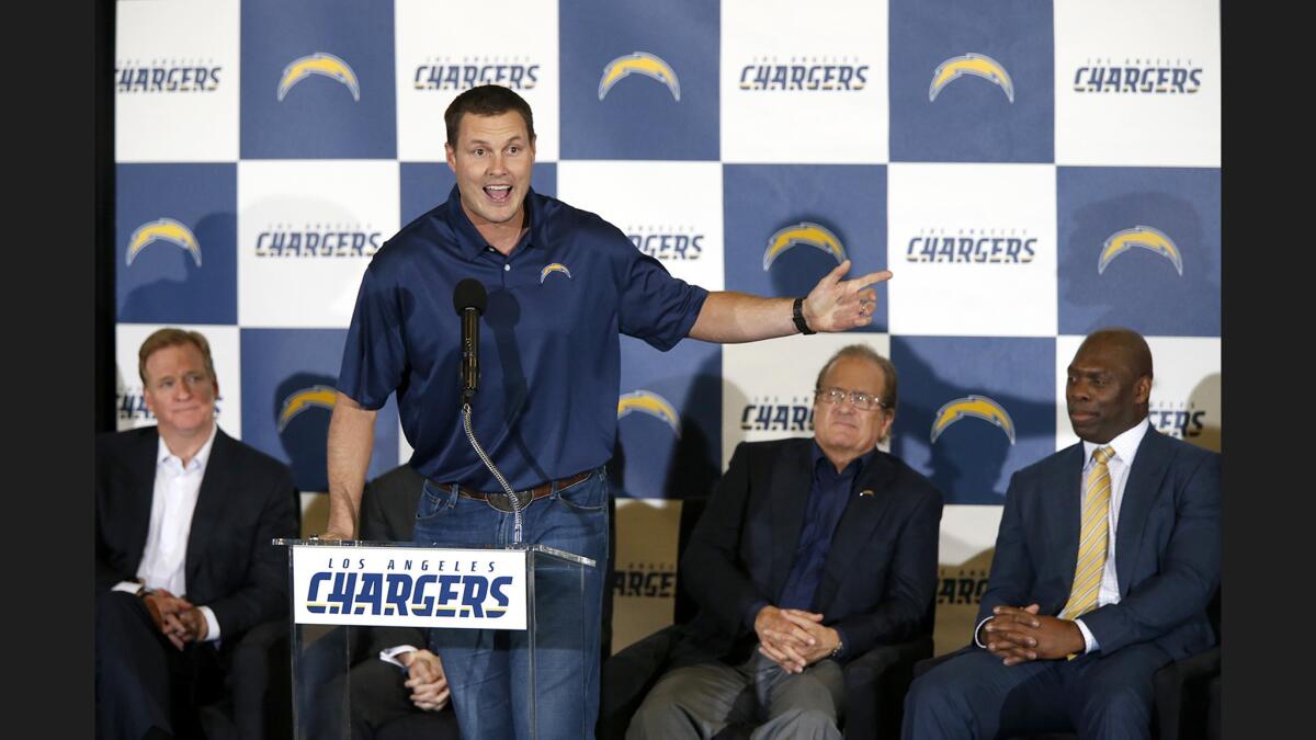 Chargers quarterback Philip Rivers speaks during a ceremony to kick off Chargers' return to L.A. at The Forum in Inglewood on Jan. 18.