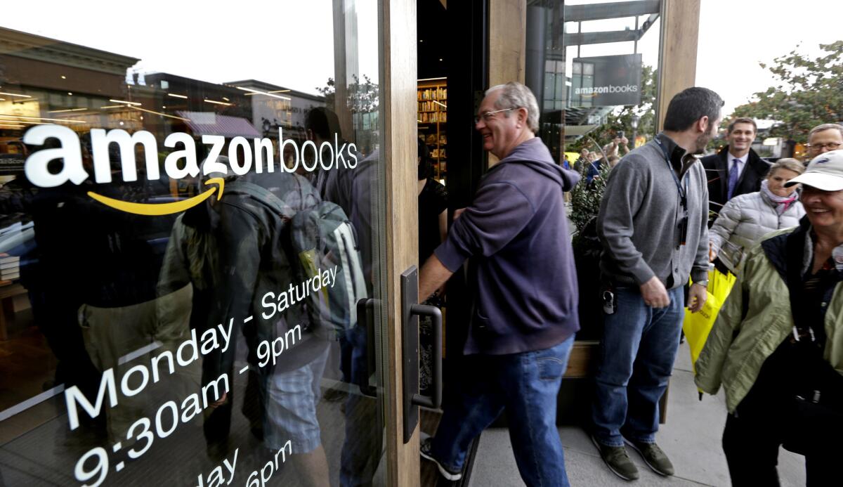 Customers enter at the opening day for Amazon Books on Nov. 3, 2015 in Seattle.