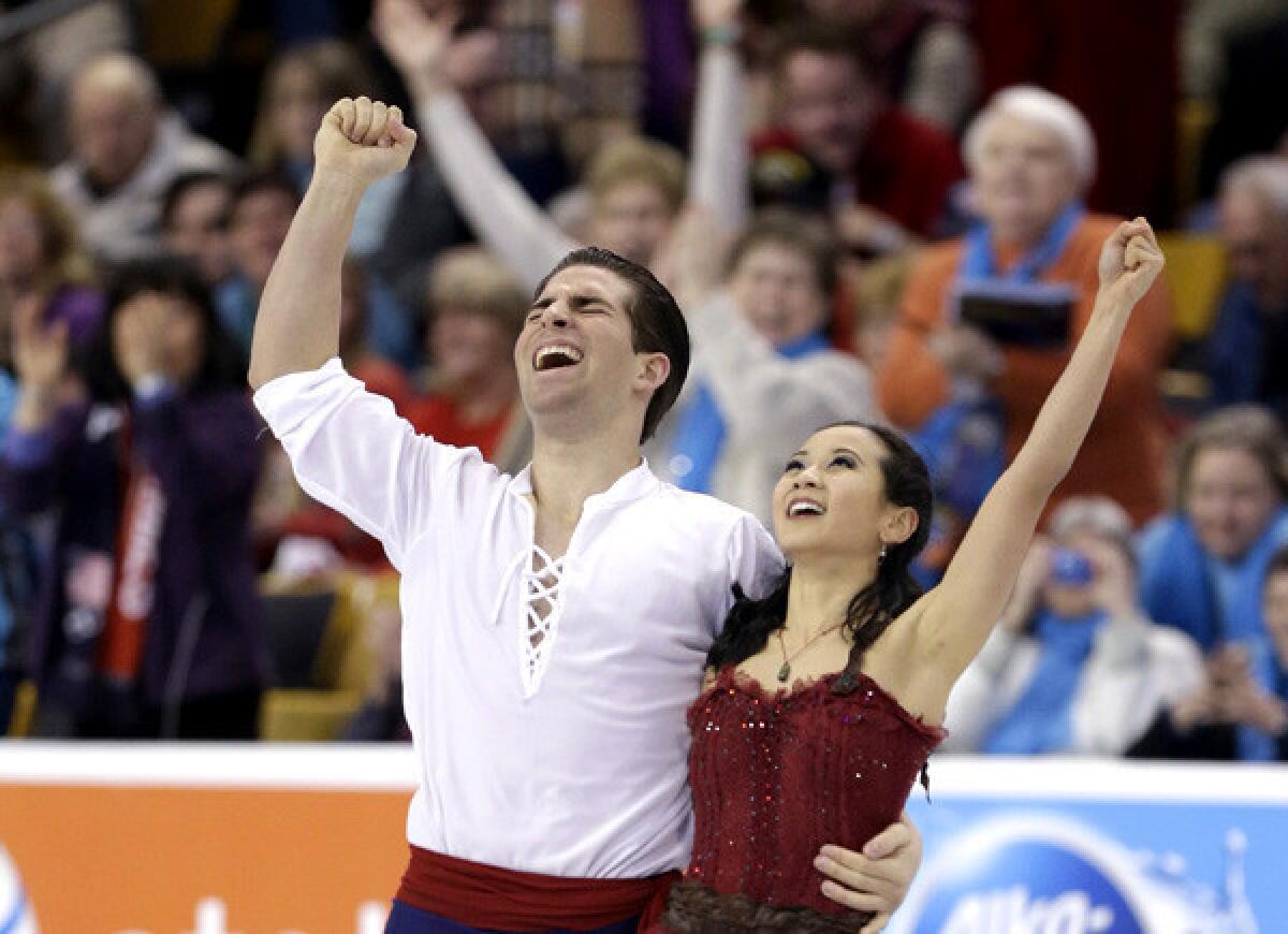 Nathan Bartholomay and Felicia Zhang react after finishing their free skate during the pair competition at the U.S. Figure Skating Championships on Saturday in Boston.