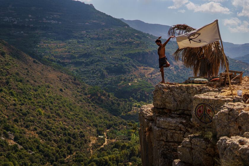 BISRI VILLAGE, LEBANON -- OCTOBER 1, 2020: Imad Baaini stretches and workout at his enclave on a cliff, at Bisri Village, Lebanon, Thursday Oct. 1, 2020. (Marcus Yam / Los Angeles Times)