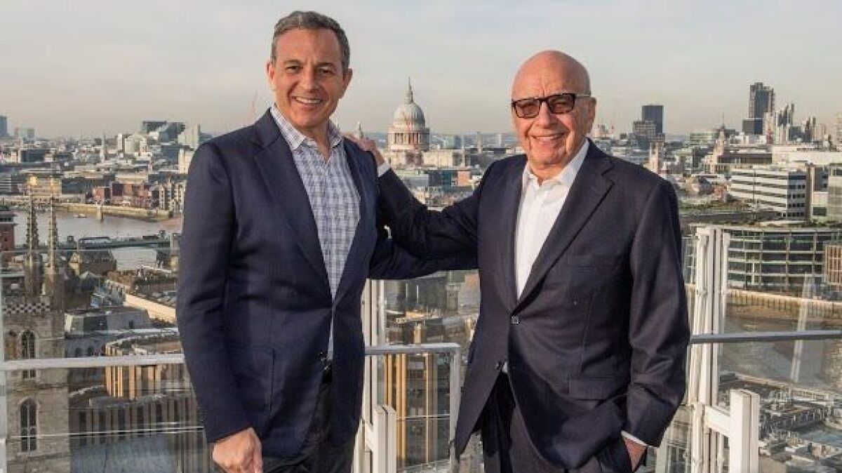 Disney CEO Bob Iger, left, and Fox controlling stockholder Rupert Murdoch.
