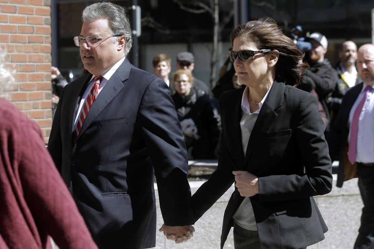 Manuel and Elizabeth Henriquez arrive at federal court in Boston to face charges in college admissions bribery scandal.