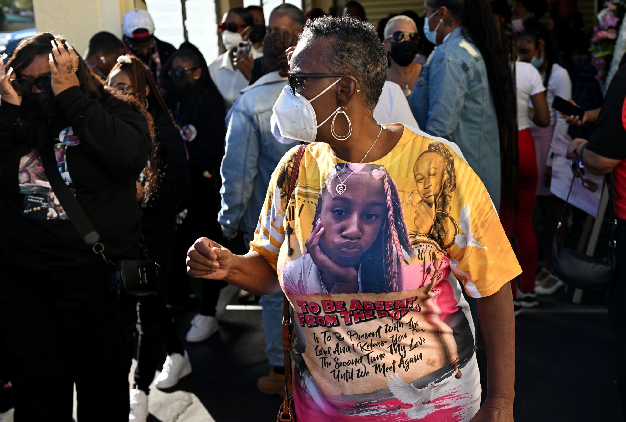 Family and friends gather at Tioni Theus' funeral.