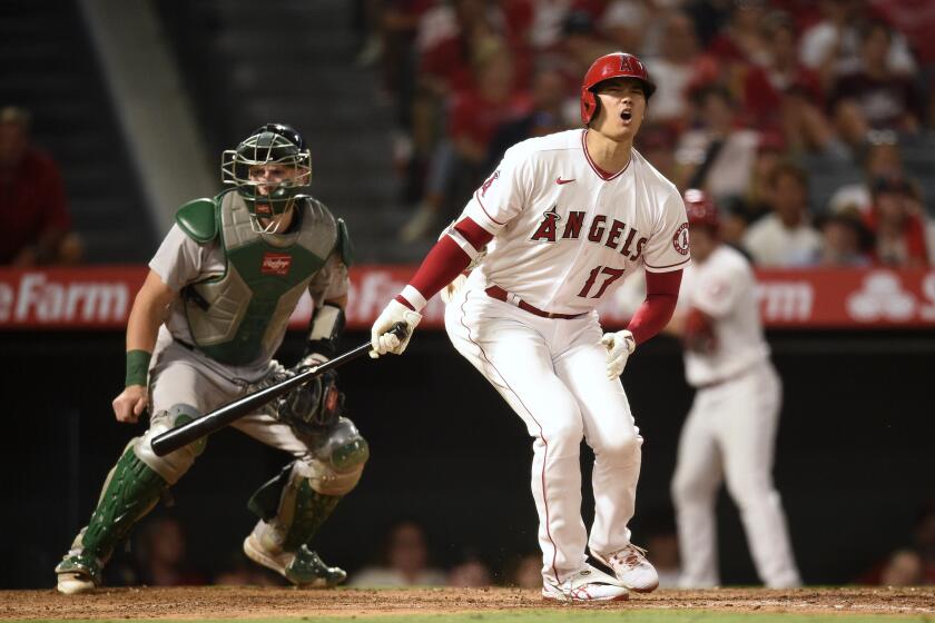 Los Angeles Angels designated hitter Shohei Ohtani reacts after a strike during the fifth inning of a baseball game against the Oakland Athletics in Anaheim, Calif., Thursday, July 29, 2021. (AP Photo/Kelvin Kuo)