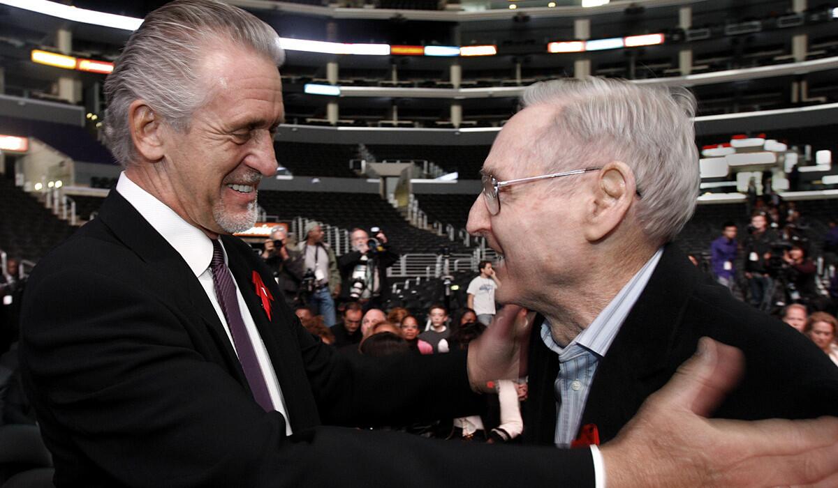 Pat Riley, left, greets Bill Sharman during a gathering on the 20th anniversary of Magic Johnson's retirement. Riley played on the 1971-72 Lakers championship team that was coached by Sharman.