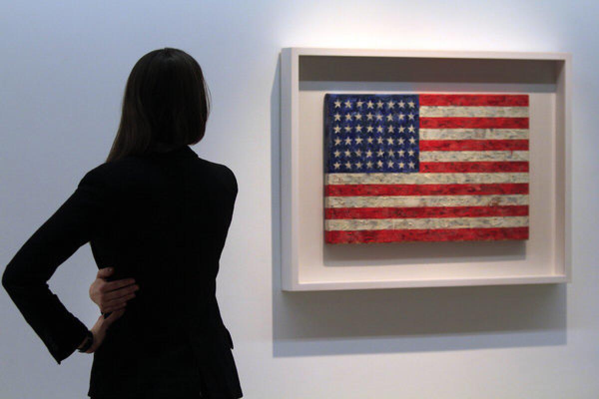 Jasper Johns, the artist behind "Flag," was defrauded by a former assistant, prosecutors say.