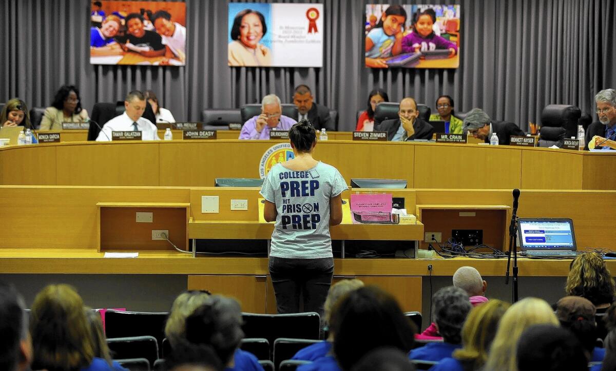 L.A. Unified board members listen to a speaker during a budget meeting at the district headquarters in downtown L.A.