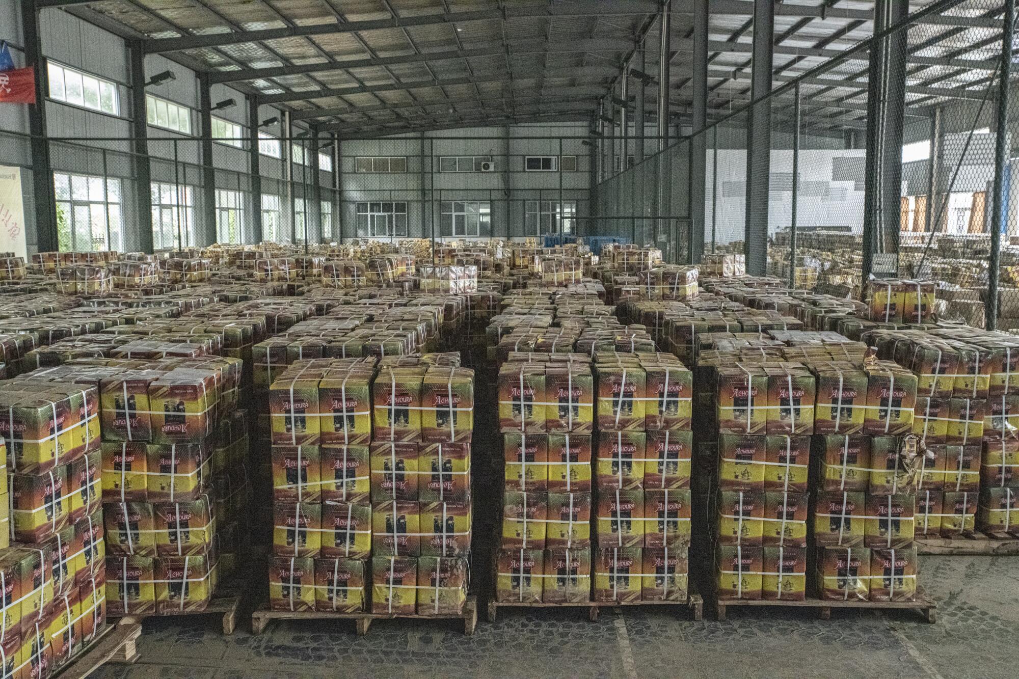Boxes of soaked tea unfit for sale await disposal at a factory in Shexian, Anhui province.