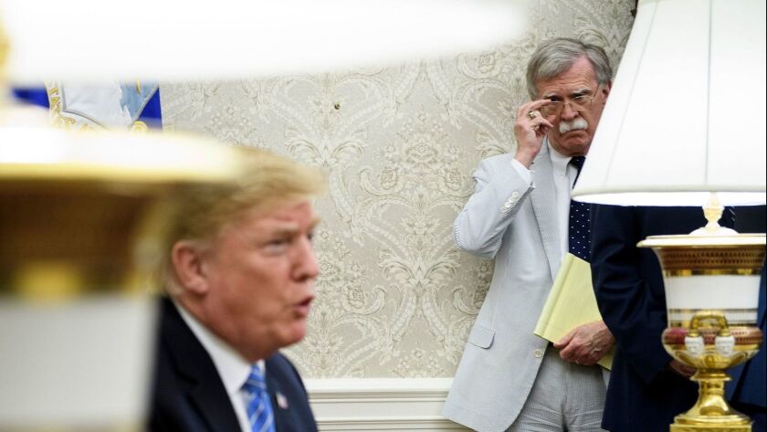National advisor John Bolton, right, shown with President Trump in May, helped raise widespread alarm over Trump’s apparent siding with Russian President Vladimir Putin over U.S. intelligence agencies.