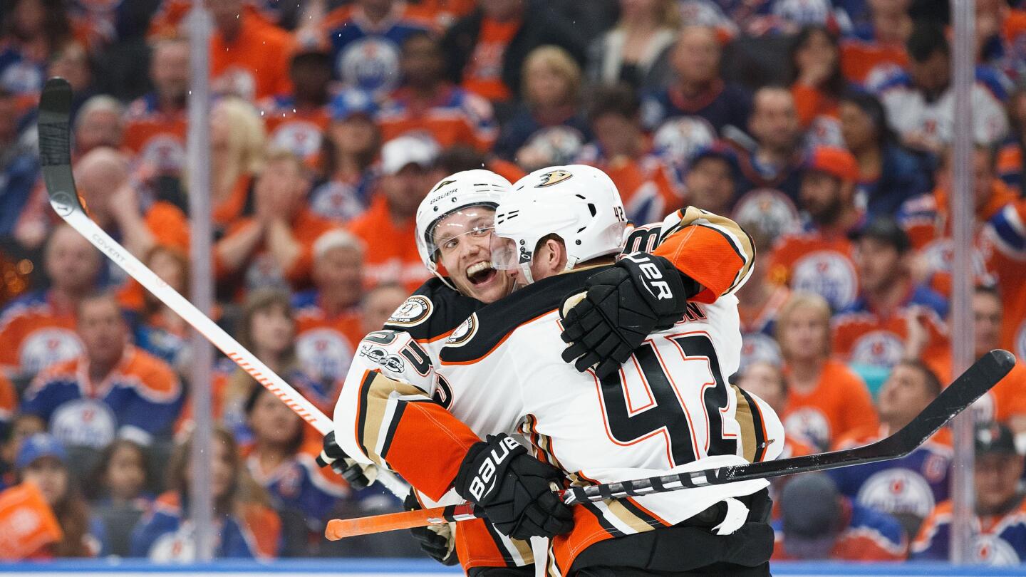 Ducks teammates Jakob Silfverberg and Josh Manson (42) celebrate Silfverberg's goal against the Edmonton Oilers.