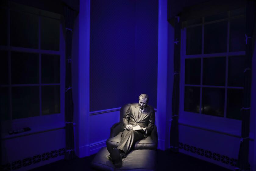 In this Wednesday, Oct. 5, 2016 photo, a sculpture of former President Richard Nixon at the Lincoln Sitting Room with a notepad is on display in the museum at the Richard Nixon Presidential Library and Museum in Yorba Linda, Calif. The museum will reopen Friday, Oct. 14, following a $15 million makeover aimed at bringing the country’s 37th president closer to younger generations less familiar with his groundbreaking trip to China or the Watergate scandal. (AP Photo/Jae C. Hong)