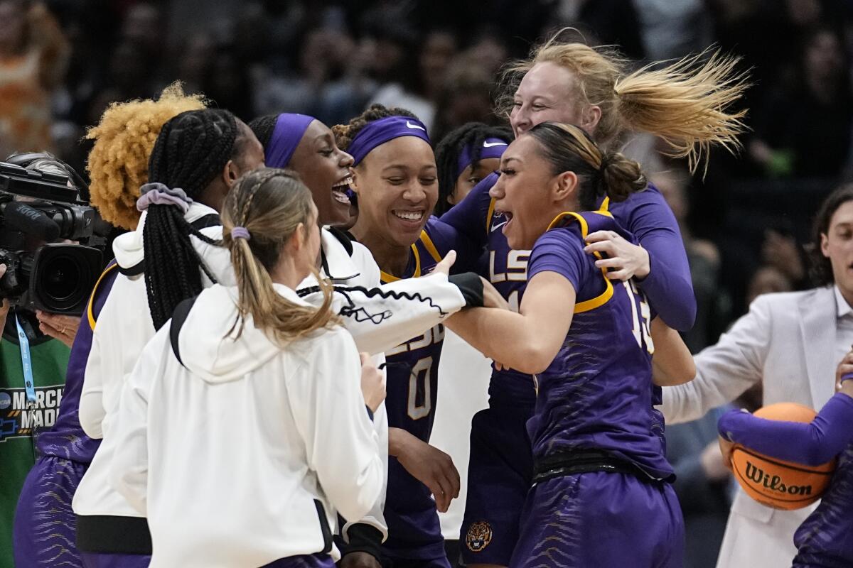 LSU players rejoice after they defeated Virginia Tech in a Final Four game March 31, 2023, in Dallas. 