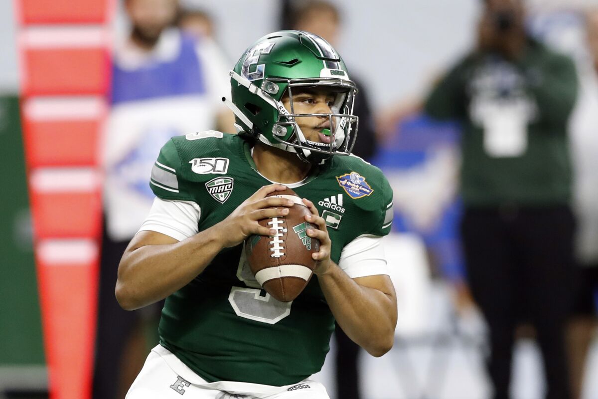 Eastern Michigan quarterback Mike Glass looks downfield during the first half of the Quick Lane Bowl against Pittsburgh.