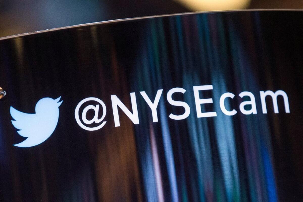 Twitter, which begins trading Thursday, set its final IPO price at $26 a share. Above, the Twitter logo is seen on the floor of the New York Stock Exchange.