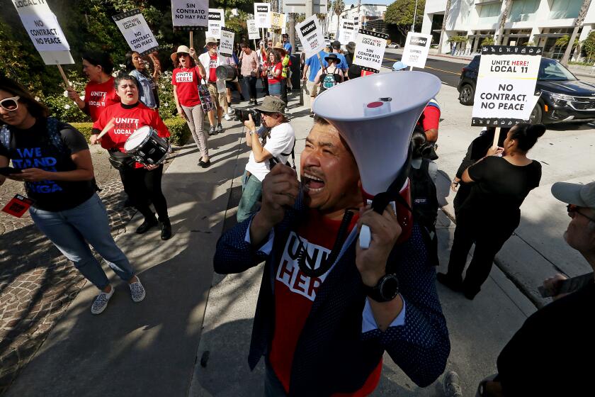 Santa Monica, CA - Members of Unite Here! Local 11 hotel workers union and members of the Writers Guild of America picket together outside the Fairmont Miramar Hotel in Santa Monica on Thursday, July 13, 2023. (Luis Sinco / Los Angeles Times)