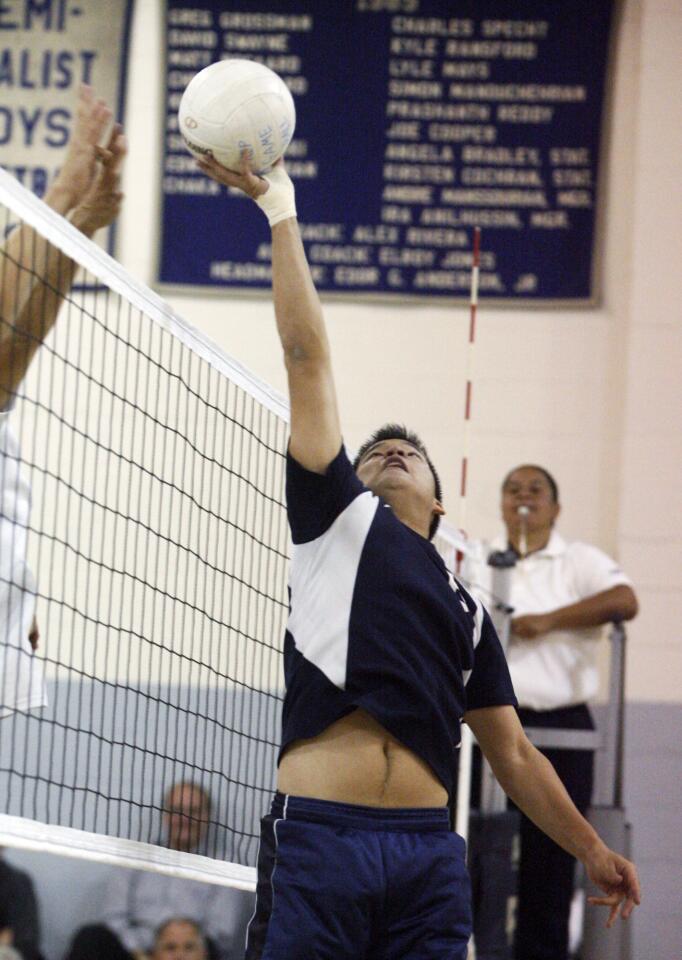 Flintridge Prep's CJ Harris attempts to touch the ball over the net in a Prep League boys volleyball game against Chadwick at Flintridge Prep on Tuesday, April 10, 2012. Chadwick won 3-0.