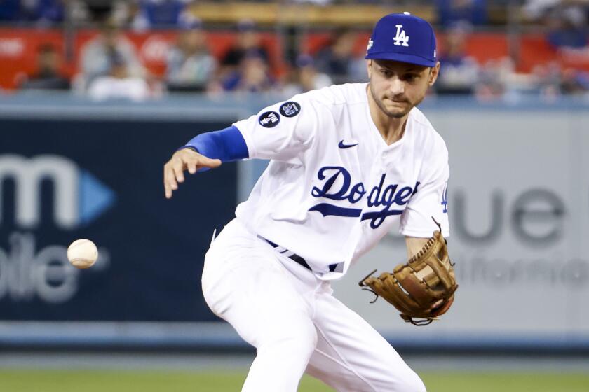 Los Angeles, CA - October 12: Los Angeles Dodgers shortstop Trea Turner makes an error.