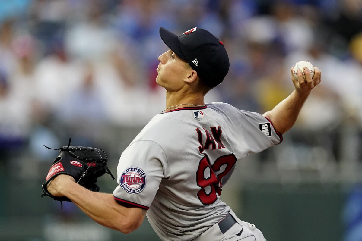 Minnesota Twins starting pitcher Griffin Jax throws during the first inning of a baseball game against the Kansas City Royals Saturday, Oct. 2, 2021, in Kansas City, Mo. (AP Photo/Charlie Riedel)