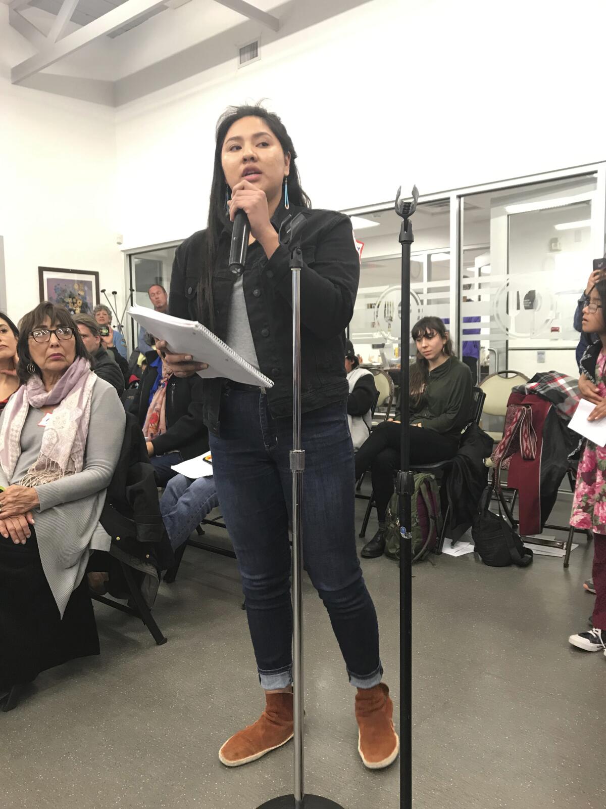 McKenzie Johnson, a Cibola High School student who is Navajo, speaks at an Albuquerque Public Schools Native American Open Community Forum in 2019 in Albuquerque, N.M., in recalling a cultural assault incident that happened to her at school and pushing for changes in the district. An appeals court ruling has revived an anti-discrimination lawsuit accusing an Albuquerque teacher of cutting off one Native American girl's hair and asking another, Johnson, if she was dressed as a “bloody Indian” during class on Halloween. (Shelby Perea/The Albuquerque Journal via AP)