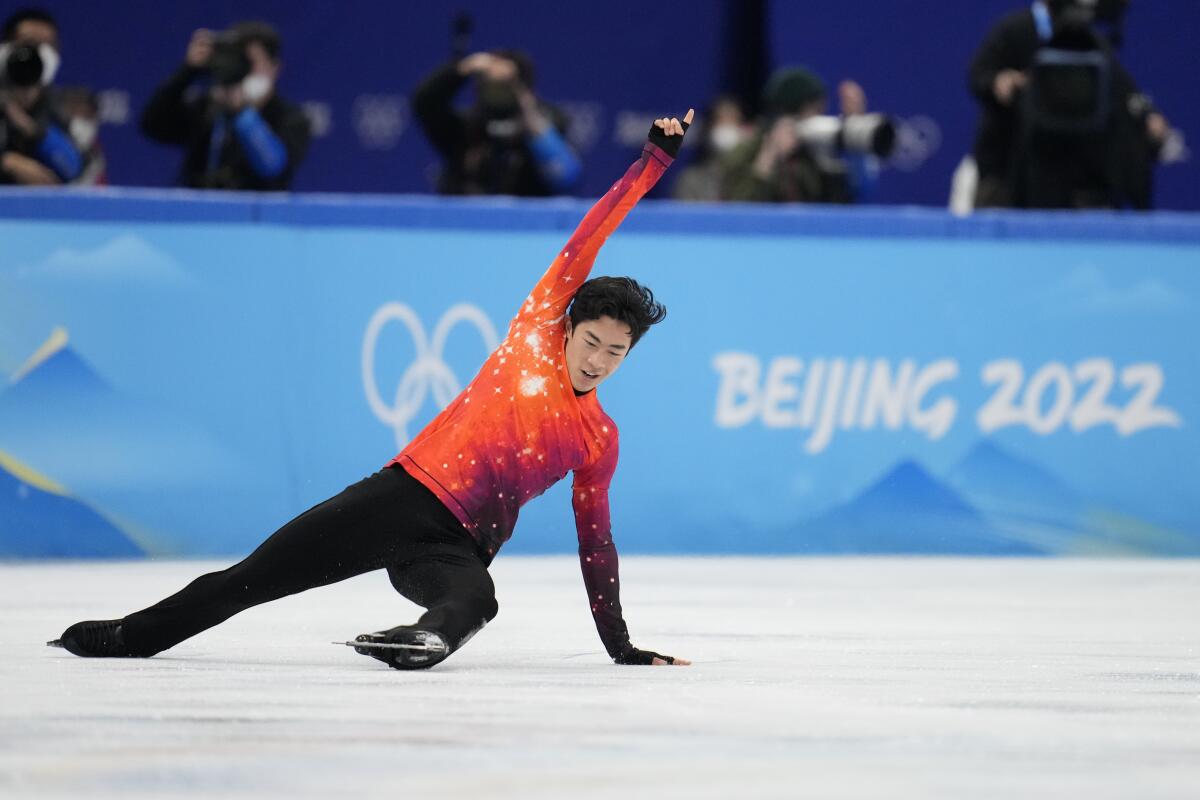 Nathan Chen competes in the men's free skate program during the figure skating event at the 2022 Winter Olympics.