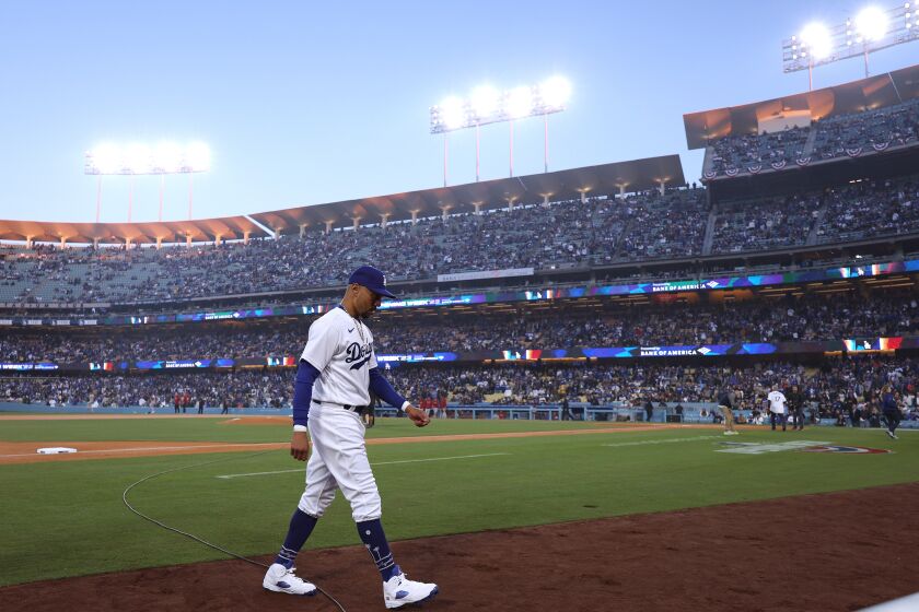 LOS ANGELES, CALIFORNIA - MARCH 30: Mookie Betts #50 of the Los Angeles Dodgers heads to the dugout.