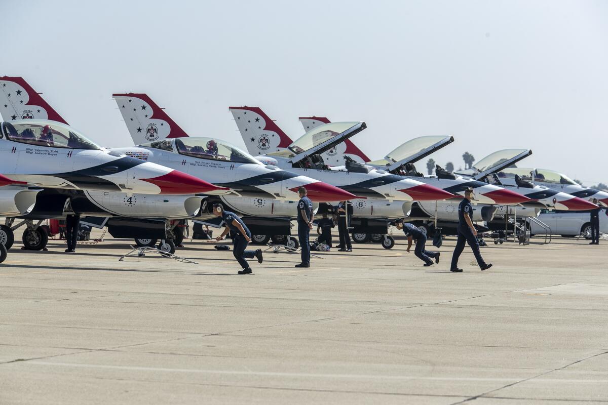 Members of the U.S. Air Force Thunderbirds arrive at the Los Alamitos Joint Forces Training Base on Thursday.