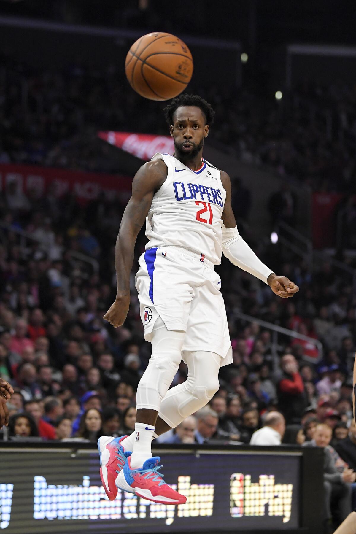 Clippers guard Patrick Beverley passes the ball during the first quarter against the Miami Heat on Feb. 5 at Staples Center. He was injured in the third quarter.