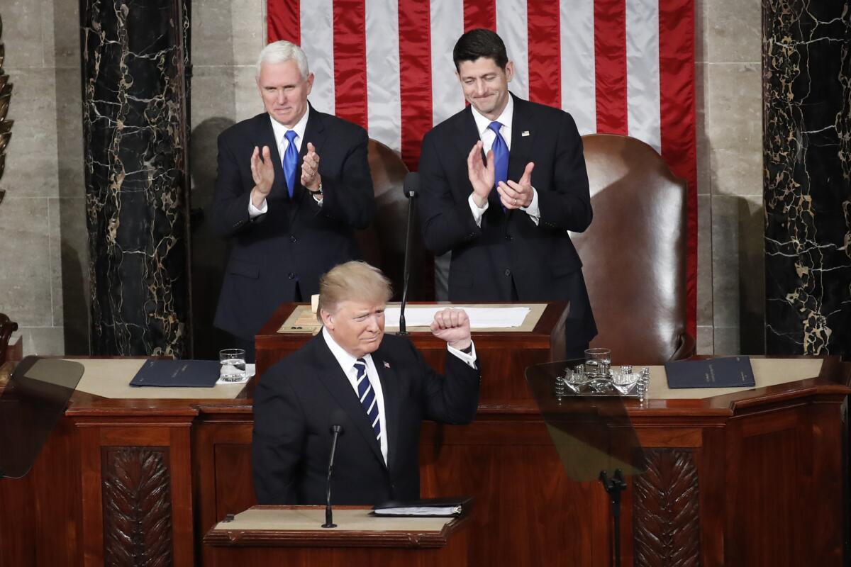 President Trump and the Republican-majority Congress have overturned 14 Obama-era regulations. He's shown with Vice President Mike Pence, left, and House Speaker Paul D. Ryan.