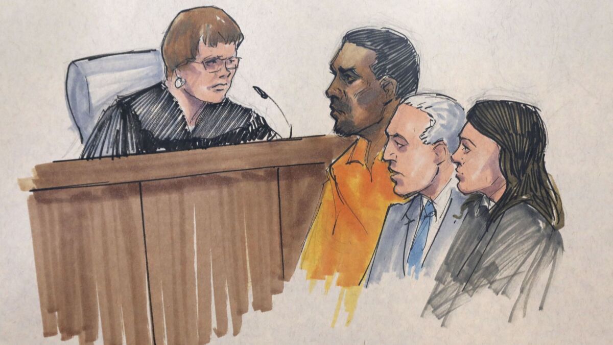 In this courtroom sketch, R&B singer R. Kelly, center, appears before U.S. Magistrate Shelia M. Finnegan, left, in U.S. District Court for the Northern District of Illinois on July 12 in Chicago.