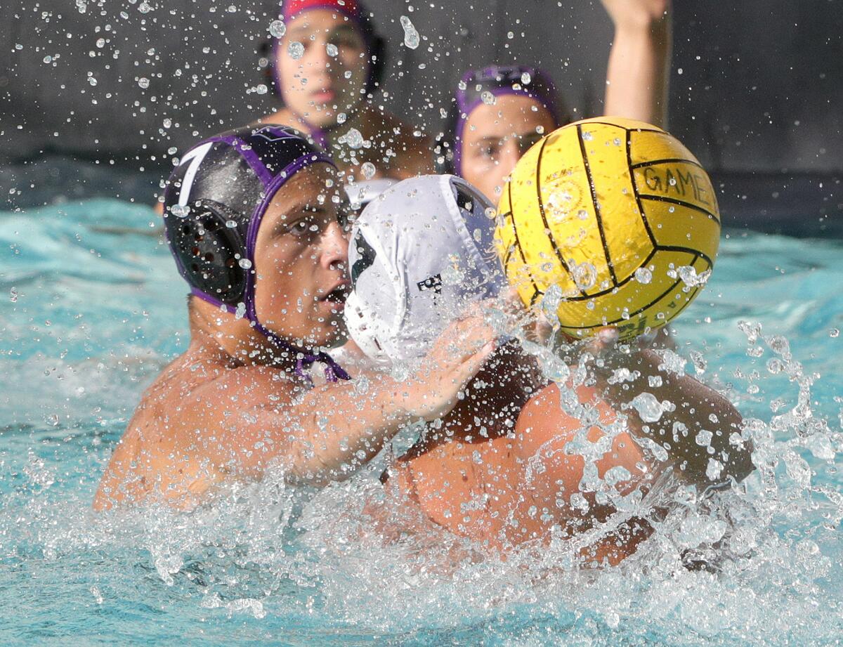 Hoover's Hakop Ansuryan eyes and reaches for the ball against Burbank's Jonathan Agazaryan during Thursday's Pacific League match.