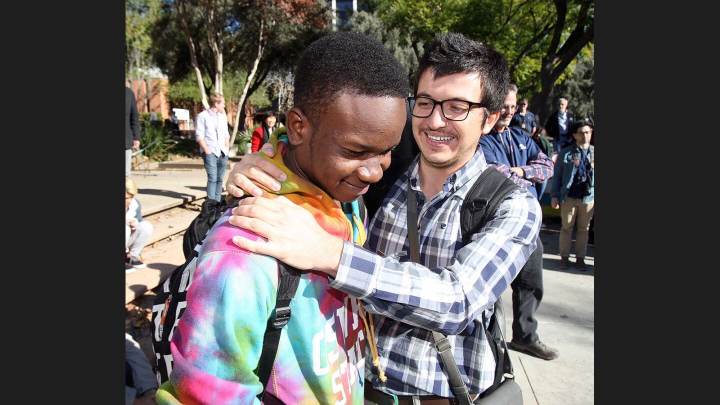 After the Tanzanian team's invention fails to pour the cup of water into the transfer chute they created, team advisor Dogan Aykurt consoles team leader Ramadhan Daud who is dejected, but tries to keep a smile, at JPL's annual Invention Challenge on Friday, December 2, 2016. 28 teams, including a team from Tanzania, but mostly of local Southern California schools, competed. The challenge was to transfer a specific amount of water over a distance to a collection cup on the other side. Methods included catapults, conveyor belts, a lot of duct tape, and pvc.