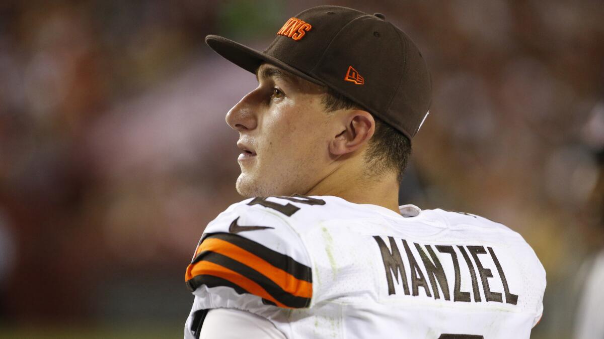 Cleveland Browns quarterback Johnny Manziel watches from the sideline during a preseason game against the Washington Redskins on Aug. 18, 2014.