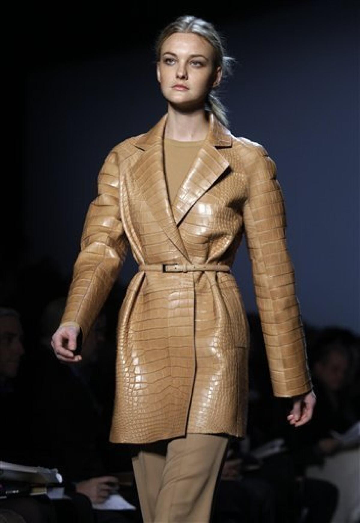 The fall 2011 collection of designer Michael Kors is modeled during Fashion Week in New York, Wednesday, Feb. 16, 2011. (AP Photo/Richard Drew)