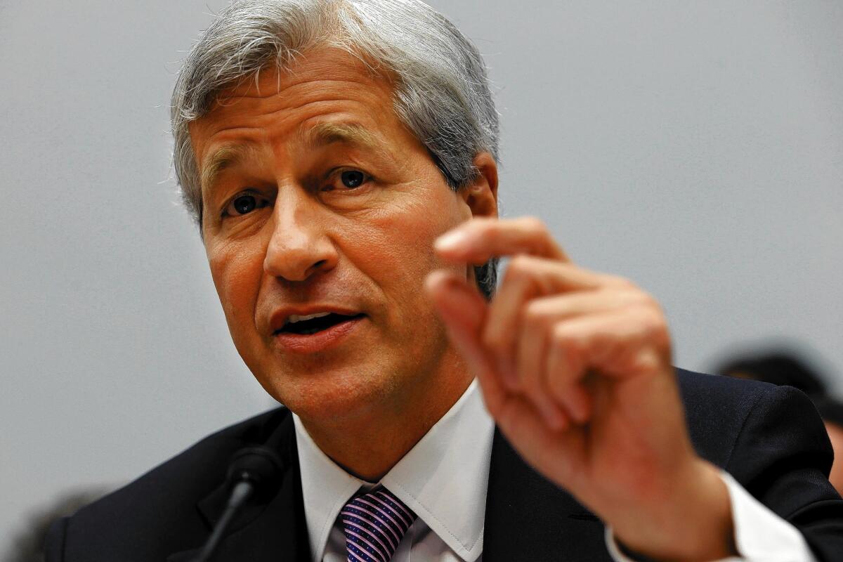 JPMorgan Chase, whose CEO Jamie Dimon is seen above, will pay a $2.6 billion fine for its failure to report Bernard Madoff to the federal government despite evidence that the bank knew of Madoff's fraudulent activities.