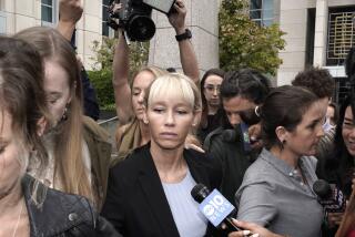 Sherri Papini leaves the federal courthouse after Federal Judge William Shubb sentenced her to 18 months in federal prison, in Sacramento, Calif., Monday, Sept. 19, 2022. Federal prosecutors had asked that she be sentenced to eight months in prison for faking her own kidnapping in 2016. (AP Photo/Rich Pedroncelli)