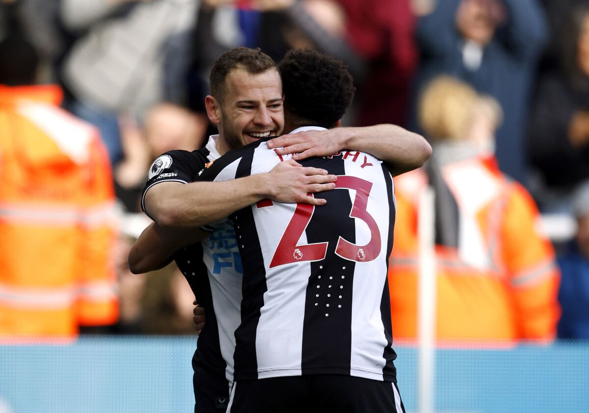 Newcastle United's Ryan Fraser, left, celebrates scoring during the English Premier League soccer match between Newcastle United and Brighton and Hove Albion at St. James' Park, Newcastle upon Tyne, England, Saturday March 5, 2022. (Richard Sellers/PA via AP)